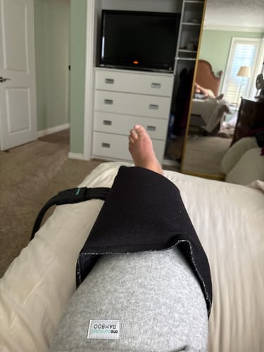 Customer's gray Premium Bamboo Leg Sleeve worn on a leg, underneath a black ice machine sleeve.