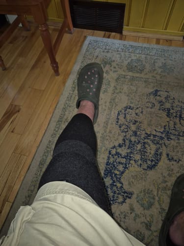 Customer's Premium Bamboo Leg Sleeve worn on their leg while sitting