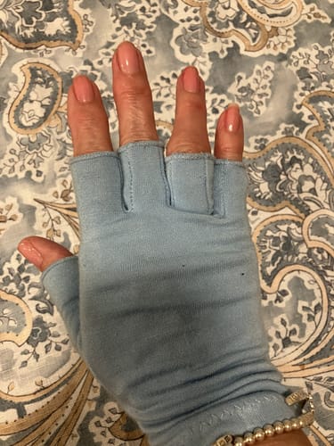 image 2 out of 2: Close-up of a customer wearing the light blue Onecompress™ Gloves, showing the shorter finger length.