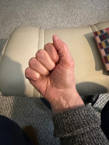 image 3 out of 3: Reviewer's hand making a fist to demonstrate improved mobility after using the gloves.