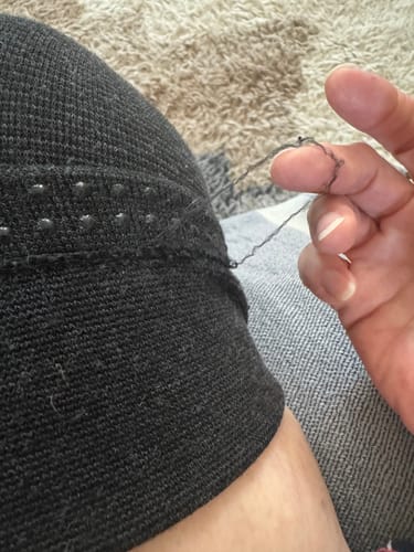 Customer's close-up of the Premium Bamboo Leg Sleeve showing stitching coming loose from the top hem.