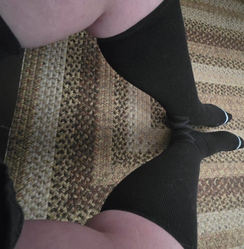 Customer's legs wearing the black, knee-high Premium Bamboo Compression Socks.